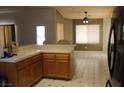 Open kitchen area with a view to the dining area, complete with tiled floors at 2201 E Dandelion St, Pahrump, NV 89048