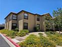 Beautiful two-story building with well-maintained landscaping and a red tile roof at 2451 N Rainbow Blvd # 1123, Las Vegas, NV 89108