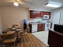 Kitchen and dining area with modern appliances, ample counter space, and laminate and tile flooring at 2451 N Rainbow Blvd # 1123, Las Vegas, NV 89108