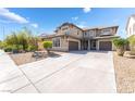 Charming two-story home boasting a three-car garage and desert-style landscaping at 2625 Cattrack Ave, North Las Vegas, NV 89081