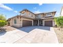 Two-story home featuring a spacious driveway and attached three-car garage at 2625 Cattrack Ave, North Las Vegas, NV 89081