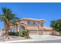 Charming two-story home with a three-car garage, desert landscaping, and a mature palm tree at 2728 Aspen Wood Ave, Henderson, NV 89074
