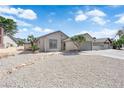 Inviting single-story home featuring desert landscaping and a spacious driveway at 3115 Floral Vista Ave, Henderson, NV 89014