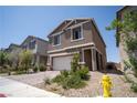 Charming two-story home with a two-car garage and desert landscaping at 3922 Painted Lady Ave, Las Vegas, NV 89141