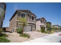 Charming two-story home with a two-car garage and desert landscaping at 3922 Painted Lady Ave, Las Vegas, NV 89141