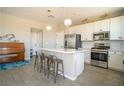 Modern kitchen with white cabinets, stainless steel appliances, and a large island at 3922 Painted Lady Ave, Las Vegas, NV 89141