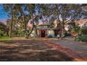 Charming single-story home featuring a unique architectural design and beautiful front yard at 55 Siddall Ave, Las Vegas, NV 89183