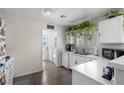 Bright kitchen area with white countertops and cabinets, and stainless steel appliances at 5550 Ramirez St, North Las Vegas, NV 89031