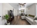 Inviting living room features wood floors, a ceiling fan, and comfortable seating at 5550 Ramirez St, North Las Vegas, NV 89031