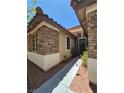 The front exterior of the house shows stone accents, complemented by well-maintained landscaping at 6009 Arbor Crest St, North Las Vegas, NV 89081
