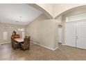 Formal dining room features high ceilings, modern light fixture, and tile floors at 6413 White Tiger Ct, Las Vegas, NV 89130