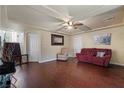 Comfortable living room featuring hardwood floors and neutral colored walls at 6705 Philharmonic Ave, Las Vegas, NV 89139