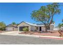 Inviting single-story home with desert landscaping, and a two-car garage at 6808 Waterhen Cir, Las Vegas, NV 89108