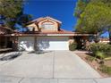 Charming two-story home with a two-car garage and low maintenance desert landscaping at 7604 Cruz Bay Ct, Las Vegas, NV 89128
