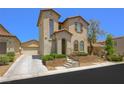 Charming two-story home with a well-manicured front yard and neutral stucco exterior at 9146 Grand Sunburst Ct, Las Vegas, NV 89149