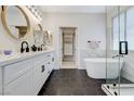 Bright bathroom with double vanity, soaking tub, and walk-in shower at 9632 Cherry Canyon Ave, Las Vegas, NV 89129