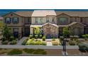 Charming townhome with stone accents, lush landscaping, and a welcoming entrance at 3220 Mckenna Dawn Ave, Henderson, NV 89044