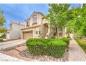 Two-story home showcases a well-kept lawn and a lovely stone walkway leading to the front door at 1844 Winners Cup Drive, Las Vegas, NV 89117