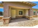 Inviting exterior view showcasing the covered entryway with brick columns at 209 Bennett Pointe Ave, Henderson, NV 89011