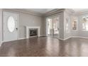 Bright living room with fireplace, tiled floors, and sliding glass doors to the outdoor space at 224 Morgyn Ln # 6, Boulder City, NV 89005