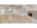 A spacious living room with wood floors and tiled fireplace at 2785 Carnation Ln # 0, Henderson, NV 89074
