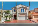 Charming two-story home with a well-manicured front yard and a two-car garage at 2851 Queens Courtyard Dr, Las Vegas, NV 89109