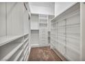 Spacious walk-in closet features custom shelving, drawers, and ample storage space for organization at 37 Stonemark Dr, Henderson, NV 89052