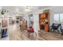 Open-concept living area flows into kitchen with modern floors and natural light at 3821 Tumbleweed Ave, Pahrump, NV 89048