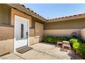 The cozy entrance features a white front door, small plants, and seating area for relaxing at 3826 Edmond St, Las Vegas, NV 89103