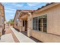Inviting home exterior showcasing a covered entryway and neutral color scheme at 4043 Lilac Creek Ct, Las Vegas, NV 89122