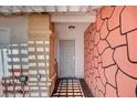 The home's secured front entry has a decorative door and stone accents at 5121 Gains Mill St, Las Vegas, NV 89122