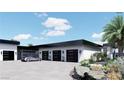 Pavered motorcourt featuring 4-car garage and modern design at 645 Dragon Peak Dr, Henderson, NV 89012