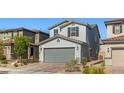 Attractive two-story home with a paved driveway, attached two-car garage, and well-maintained landscaping at 6964 Caldera St, Las Vegas, NV 89149