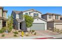 Attractive two-story home with a neat front yard and a convenient two-car garage at 6964 Caldera St, Las Vegas, NV 89149