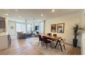 Bright, open-concept living and dining area with hardwood floors and lots of natural light at 739 Wild Highlands Ln, Henderson, NV 89015