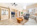 Spacious living area features neutral decor, fireplace, tile floors, and lots of natural light at 7450 S Eastern Ave # 1058, Las Vegas, NV 89123