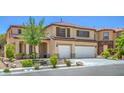 Front of beige two-story home featuring a well-manicured lawn, double garage and neutral accents at 7619 Comanche Canyon Ave, Las Vegas, NV 89113