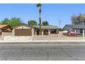 Charming single-story home with a desert landscaped front yard and a spacious driveway at 809 Greenbrook St, Las Vegas, NV 89110