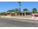 Inviting single-story home with low-maintenance desert landscaping and a private, gated front yard at 809 Greenbrook St, Las Vegas, NV 89110