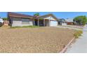 View of the home with low-maintenance landscaping at 824 Antigua St, Las Vegas, NV 89145
