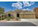 Inviting single-story home featuring a two-car garage, low maintenance landscaping, and stone facade details at 83 Buckthorn Ridge Ct, Las Vegas, NV 89183