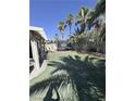 Backyard with an artificial lawn and a trampoline at 8484 Montana Stream Ave, Las Vegas, NV 89113