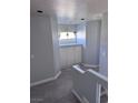 Upstairs hallway area with built-in storage cabinet at 8484 Montana Stream Ave, Las Vegas, NV 89113