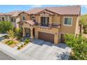 Lovely two-story home featuring a tile roof, balcony, three-car garage and mature landscaping at 9635 Ramon Valley Ave, Las Vegas, NV 89149