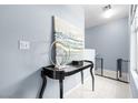Upstairs hall featuring light blue walls, white tile floors, and black table at 109 Breezy Tree Ct # 202, Las Vegas, NV 89145
