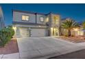 Two-story home boasts a three-car garage and well-maintained landscaping at 1717 Jake Andrew Ave, North Las Vegas, NV 89086