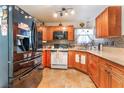 Modern kitchen featuring stainless steel appliances, granite countertops, and mosaic tile backsplash at 1723 Candice St, Las Vegas, NV 89156