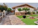 Spacious brick driveway leads to an iron gate and manicured front yard at 2112 Los Altos St, Las Vegas, NV 89102