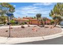 Charming single-story home featuring desert landscaping, circular driveway, and a two-car garage at 2537 Seascape Dr, Las Vegas, NV 89128