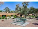 Exterior shot of a community picnic area with benches and well-maintained landscaping at 2732 Heritage Ct, Las Vegas, NV 89121